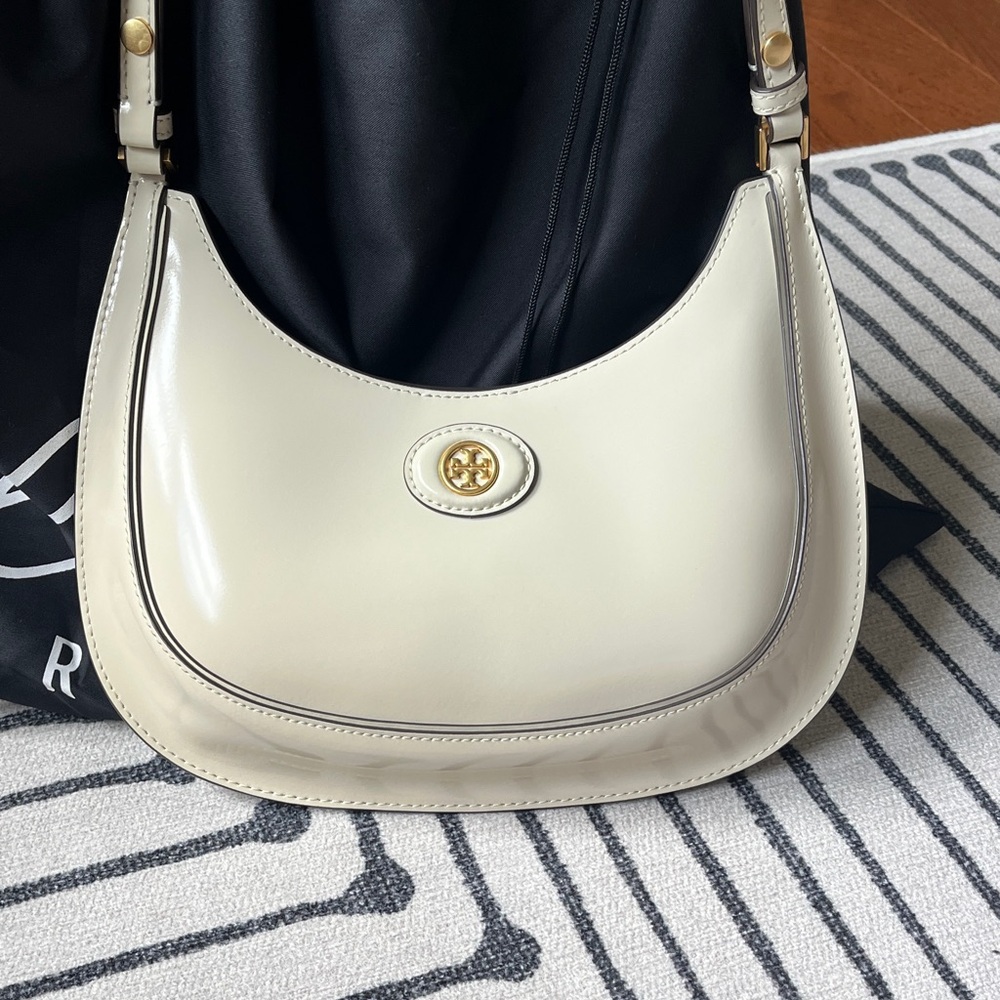 Tory Burch Cream Patent Crescent Shoulder Bag with Gold Emblem